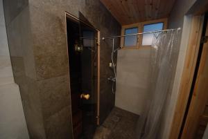 a shower with a glass door in a bathroom at Otepää Holiday Home in Otepää