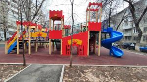 a park with a playground with a slide at Золотой квадрат 60 кв2 in Almaty