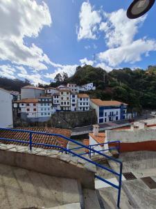 a frisbee flying over a city with buildings at Casina del Puerto in Cudillero