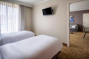 En eller flere senge i et værelse på Marriott Executive Apartments Brussels