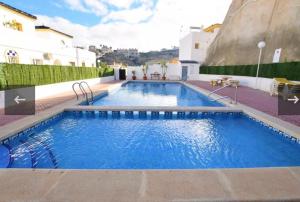 The swimming pool at or close to Beautiful apartment at La Marquesa Golf Quesada