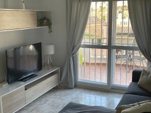A television and/or entertainment centre at Beautiful apartment at La Marquesa Golf Quesada