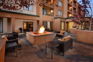 a courtyard with a fire pit in front of a building at Courtyard Beckley in Beckley