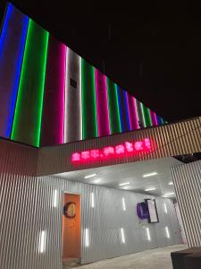 a building with colorful lights on the wall at Nuu Motel in Sao Paulo