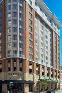 a large building on the corner of a street at Courtyard by Marriott Baltimore Downtown/Inner Harbor in Baltimore