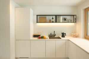 Η κουζίνα ή μικρή κουζίνα στο Ciasa Plandros Apartments