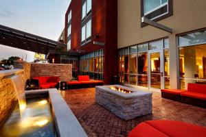 a patio with a fire pit and a building at SpringHill Suites by Marriott Columbus OSU in Columbus