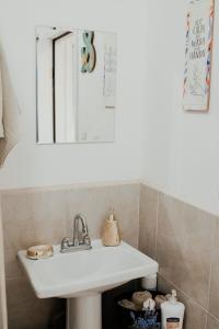 a bathroom with a sink and a mirror at Casa Colibri @ Guadalupe Valley in Valle de Guadalupe