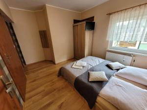 Łóżko lub łóżka w pokoju w obiekcie Ośrodek Wypoczynkowy Romed