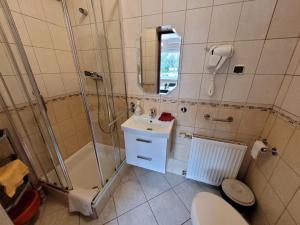 Łazienka w obiekcie Ośrodek Wypoczynkowy Romed