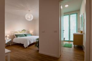 Postel nebo postele na pokoji v ubytování B&B Quattro Stagioni Charme and Wellness