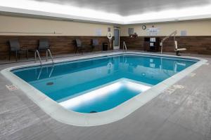 a large swimming pool in a hotel room at Fairfield Inn & Suites Jefferson City in Jefferson City