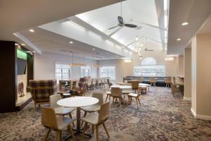 a dining area with tables and chairs in a room at Residence Inn by Marriott Williamsburg in Williamsburg