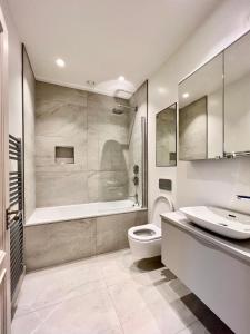 a bathroom with a toilet and a sink at The Apartments Lytham Square in Lytham St Annes