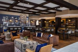 a lobby with leather couches and a bar at The Westin Washington, D.C. City Center in Washington