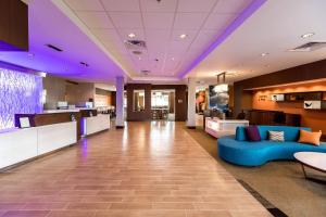 a lobby of a hospital with a blue couch at Fairfield Inn & Suites by Marriott Atlanta Acworth in Acworth