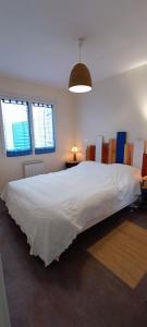 Posteľ alebo postele v izbe v ubytovaní Baleiniers - Maison 6 pers - prox mer - Les sables