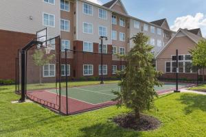 a tennis court in front of a building at Residence Inn Dayton North in Dayton