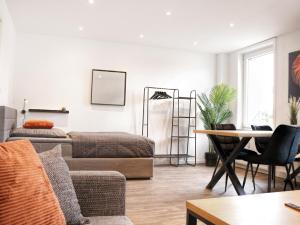 Posezení v ubytování LIGHTPLACE • Größere Gruppen • 4 Einzelzimmer • Boxspring • Smart TV • Biergarten • Restaurant + 47 fotografií