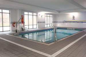 a large swimming pool in a building at TownePlace Suites by Marriott Petawawa in Petawawa