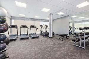 a gym with several treadmills and cardio machines at Fairfield Inn & Suites by Marriott Cincinnati Airport South/Florence in Florence