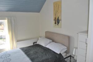 A bed or beds in a room at Douglas Lodge Holiday Homes