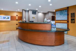 a lobby of a hospital with a reception counter at SpringHill Suites by Marriott Lancaster Palmdale in Lancaster