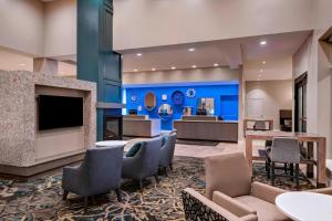 a hotel lobby with a fireplace and furniture at Residence Inn by Marriott St. Paul Downtown in Saint Paul