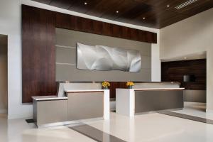 a lobby with a large white sculpture on the wall at Courtyard by Marriott Los Angeles L.A. LIVE in Los Angeles