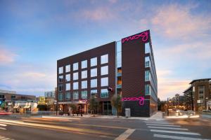 a large building with pink writing on the side of it at Moxy Austin - University in Austin