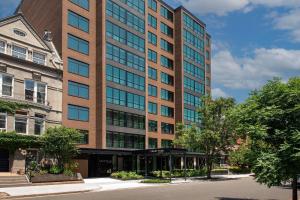 a tall building with a street in front of it at Courtyard by Marriott Washington, DC Dupont Circle in Washington