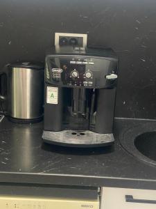 a coffee maker sitting on top of a counter at Apartment DobraYa Blue in Novi Sad