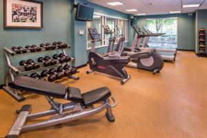 a gym with several treadmills and cardio machines at Springhill Suites by Marriott State College in State College