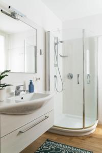 a bathroom with a sink and a shower at Casa Divina - Cadenabbia in Griante Cadenabbia