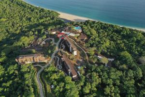 an aerial view of a resort with a road and the ocean at W Costa Rica Resort – Playa Conchal in Playa Conchal