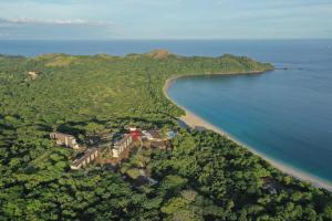 an aerial view of a beach and the ocean at W Costa Rica Resort – Playa Conchal in Playa Conchal