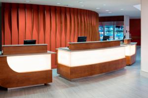 a lobby with reception desks and red walls at Residence Inn by Marriott Seattle Downtown/Lake Union in Seattle