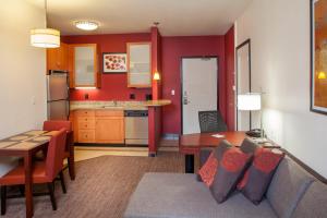 a living room with a couch and a table at Residence Inn Prescott in Prescott