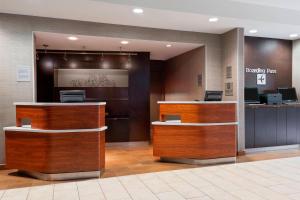 a lobby of a hotel with a reception desk at Courtyard Tampa Downtown in Tampa