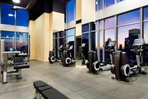 a gym with a view of a city skyline at Courtyard by Marriott Montreal Downtown in Montréal