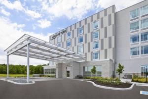 a rendering of the front of a hotel building at SpringHill Suites by Marriott Indianapolis Westfield in Westfield