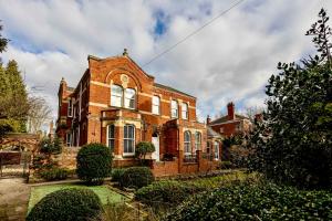 a large brick house with at Coppergate Mews Grimsby No7 - 2 bed, 2 bath, 1st floor apartment in Grimsby