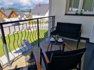 Balkón alebo terasa v ubytovaní Deluxe Apartment Lipno - Lake Side Village, Frymburk nad Vltavou