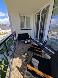 Balkón alebo terasa v ubytovaní Deluxe Apartment Lipno - Lake Side Village, Frymburk nad Vltavou