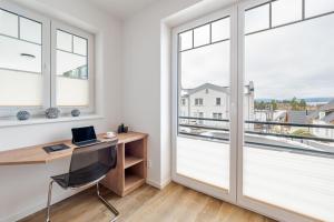 Televízia a/alebo spoločenská miestnosť v ubytovaní Deluxe Apartment Lipno - Lake Side Village, Frymburk nad Vltavou