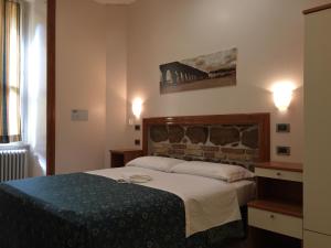 Postel nebo postele na pokoji v ubytování Optimus B&B