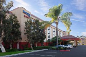 a hotel with a parking lot in front of a building at Fairfield Mission Viejo Orange County in Mission Viejo