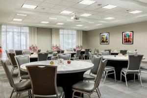 a conference room with tables and chairs in it at Aloft Tallahassee Downtown in Tallahassee