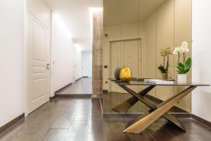 a dining room with a table and a mirror at Dei Martiri Suite in Naples