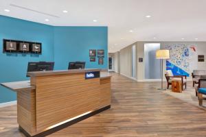 a lobby of a dental office with a reception counter at TownePlace Suites by Marriott Panama City Beach Pier Park in Panama City Beach